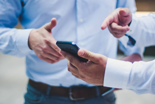 Two businessmen discussing examples of an ideal customer profile